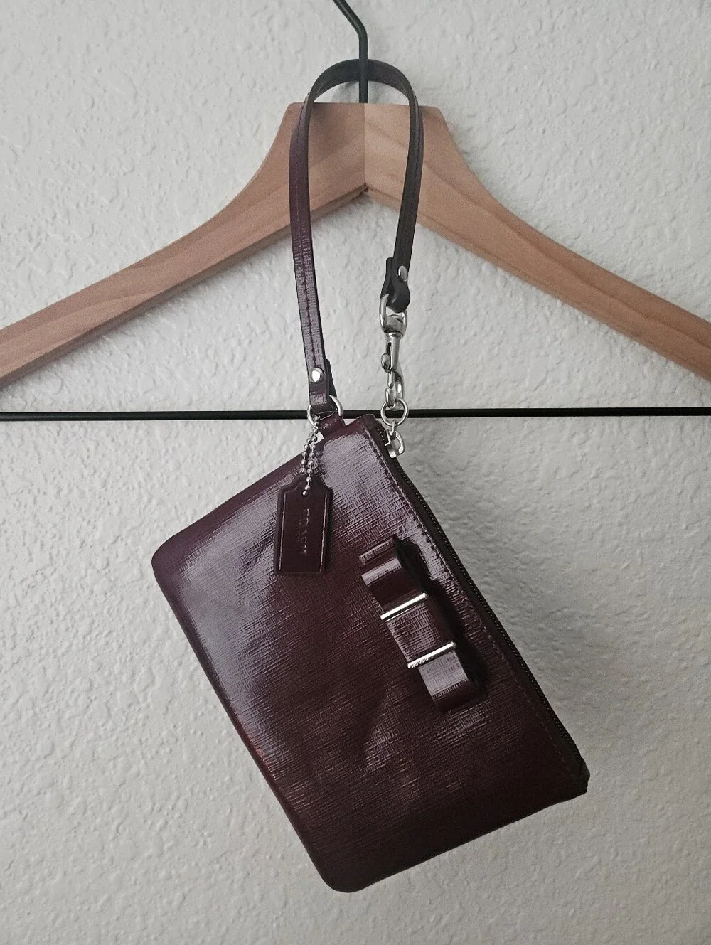coach mahogany wristlet with bow